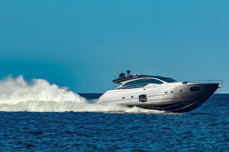 grey speedboat moving fast by river latvia water sport + marine thruster services