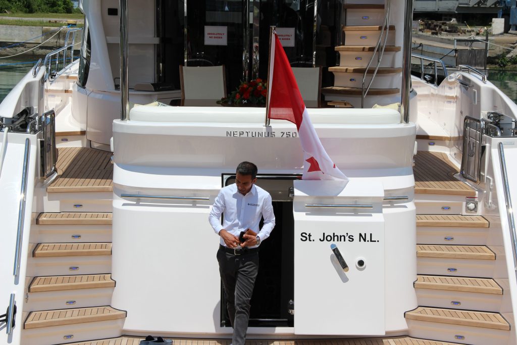 yacht manager just got out from the stern of neptunus 750 yacht - ignition marine yacht management