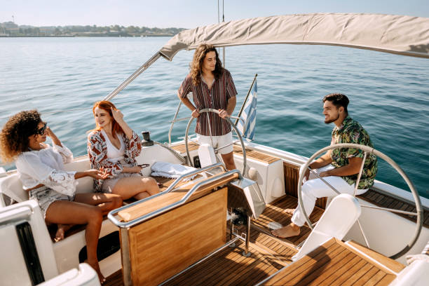roup of friends having casual conversation while riding on a yacht