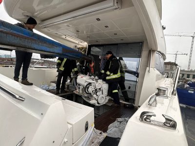 ignition marine technicians doing repair services on white prestige 550 yacht-ignition marine services